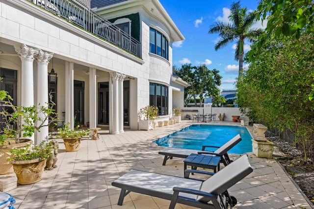 view of swimming pool with a patio