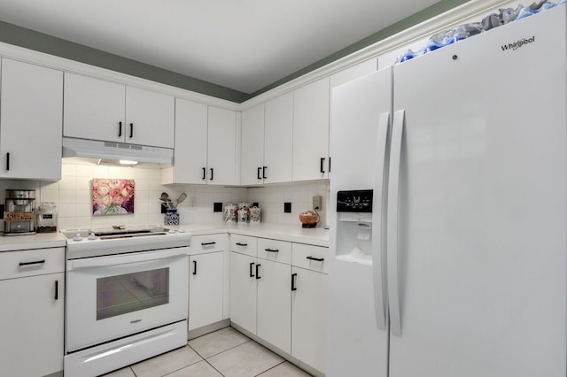 kitchen featuring white cabinets and white appliances