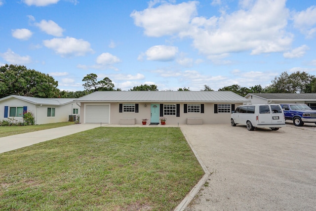 ranch-style house with a front lawn, concrete driveway, stucco siding, metal roof, and an attached garage