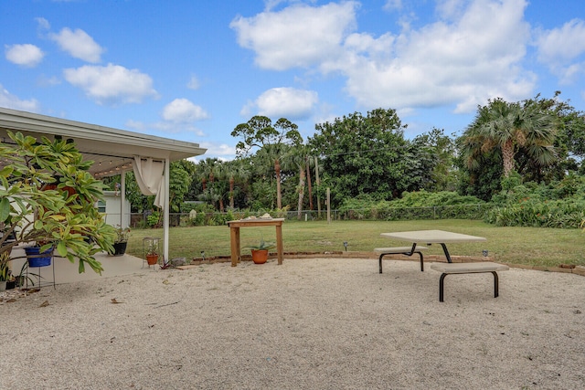 view of play area featuring a patio area and a yard