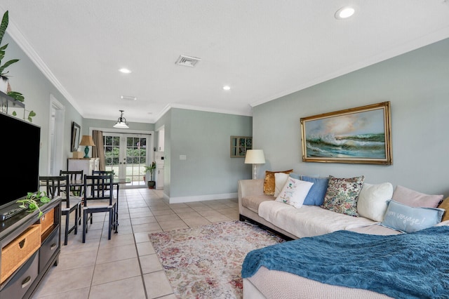 tiled living room with french doors and crown molding