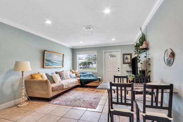 tiled living room featuring a textured ceiling and crown molding