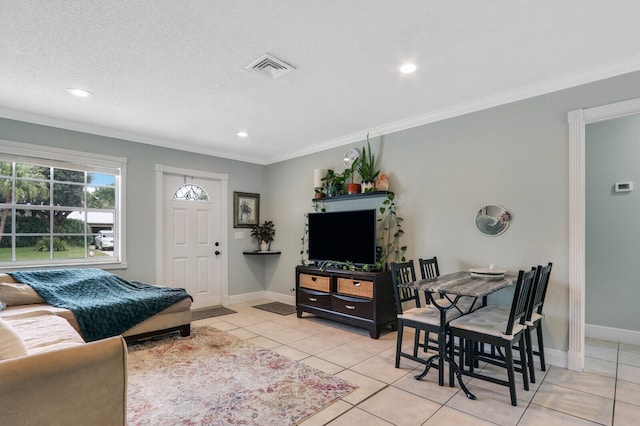 tiled living room with a textured ceiling and crown molding