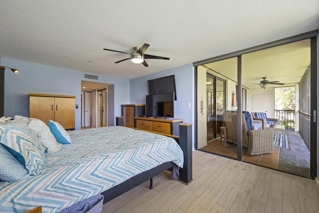 bedroom featuring a textured ceiling and ceiling fan