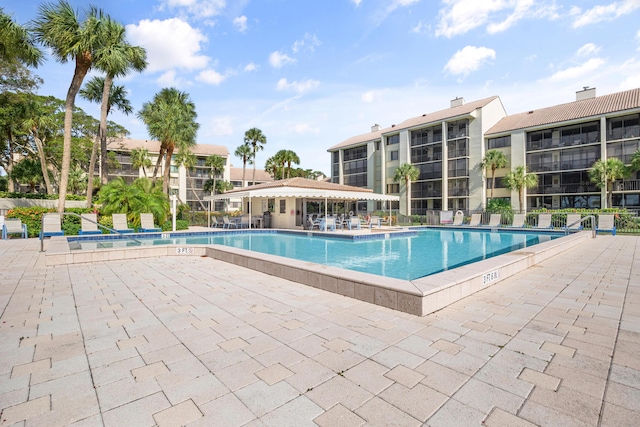 view of swimming pool with a patio