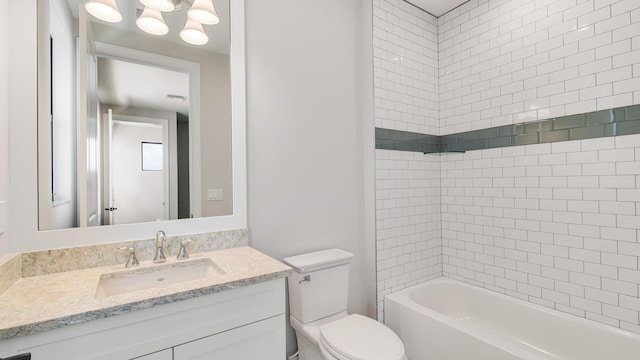 full bathroom with vanity, toilet, and tiled shower / bath combo