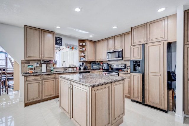 kitchen featuring stainless steel appliances, a kitchen island, light stone counters, and light tile patterned floors