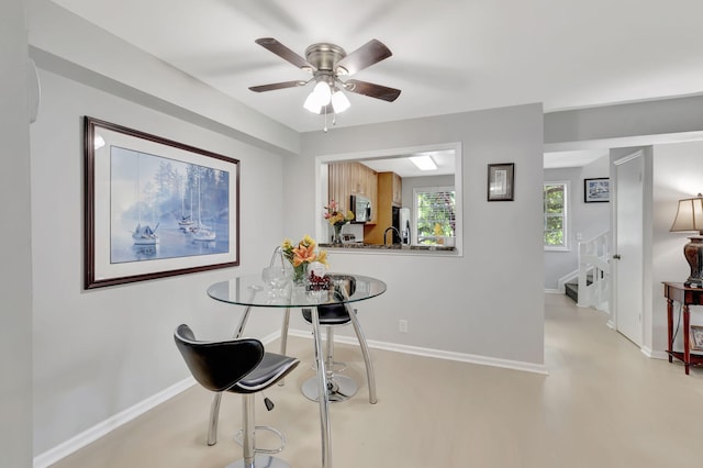 dining room featuring ceiling fan