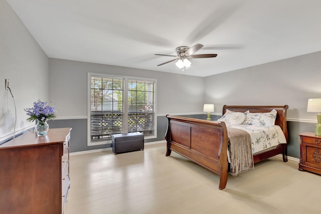 bedroom with light hardwood / wood-style flooring and ceiling fan