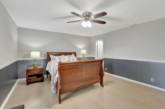 bedroom with ceiling fan and light hardwood / wood-style flooring