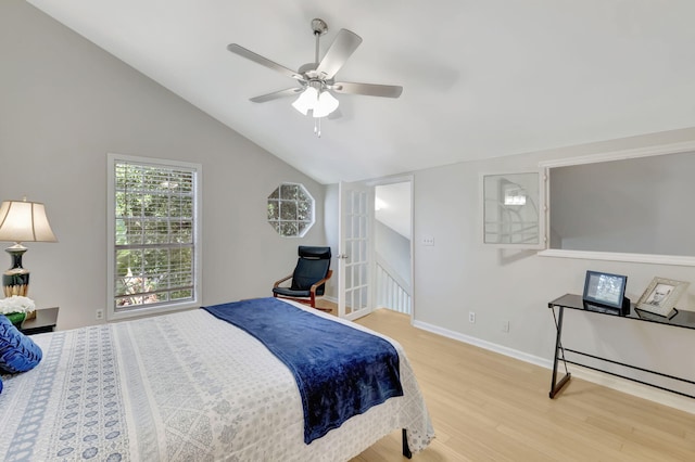 bedroom featuring vaulted ceiling, light hardwood / wood-style flooring, and ceiling fan