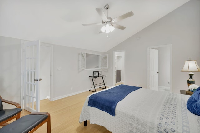 bedroom with ceiling fan, light hardwood / wood-style flooring, and lofted ceiling