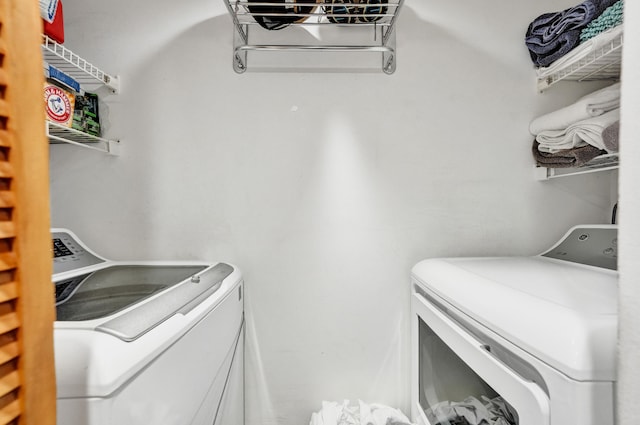 laundry area featuring washing machine and clothes dryer