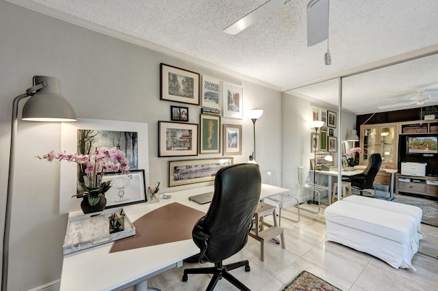 tiled office with ceiling fan, a textured ceiling, and crown molding