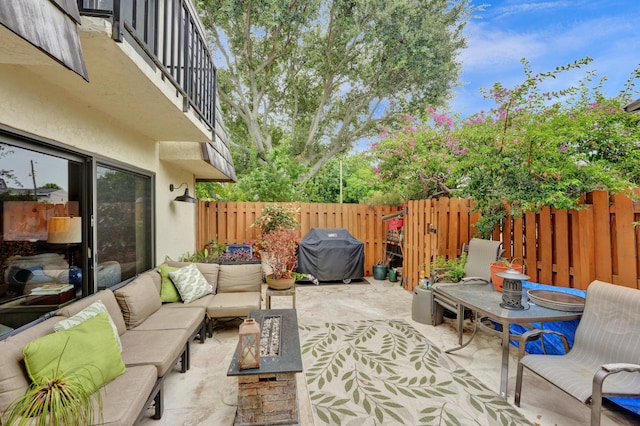 view of patio / terrace featuring an outdoor hangout area and a grill