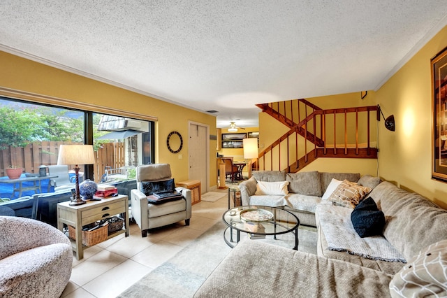 tiled living room with a textured ceiling and crown molding