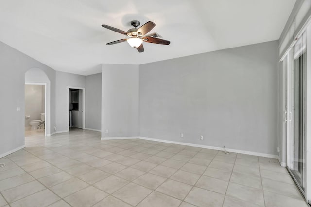 unfurnished room with light tile patterned floors and ceiling fan