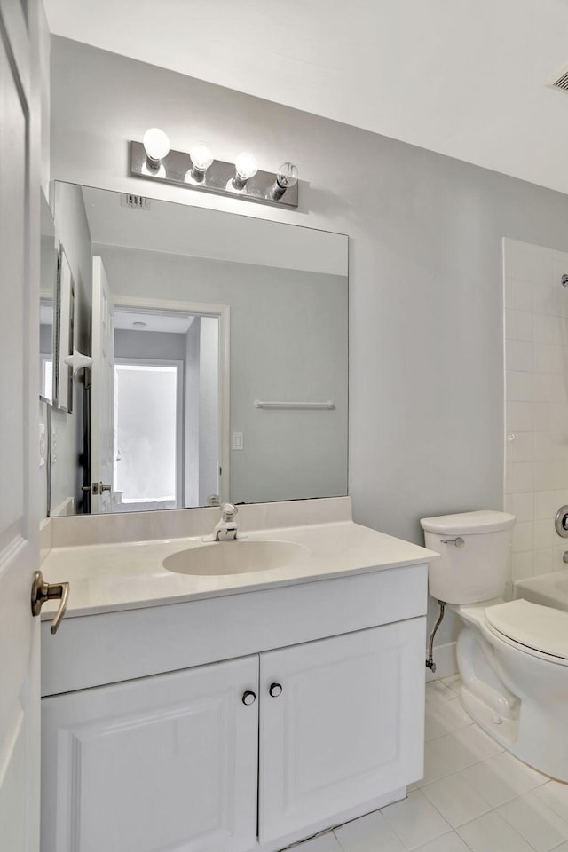 full bathroom featuring vanity, toilet, bathing tub / shower combination, and tile patterned flooring