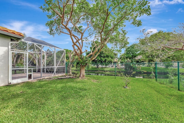 view of yard with a lanai