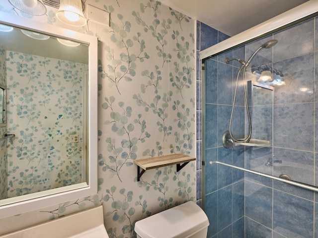 bathroom with walk in shower and toilet