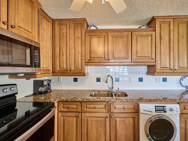 kitchen featuring washer / clothes dryer, decorative backsplash, appliances with stainless steel finishes, and ceiling fan