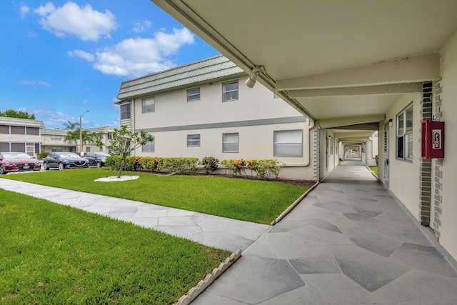 view of property exterior featuring a lawn