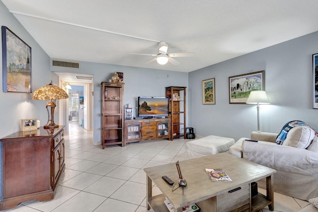 tiled living room featuring ceiling fan