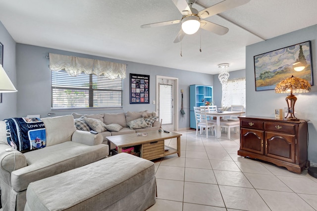 tiled living room featuring ceiling fan