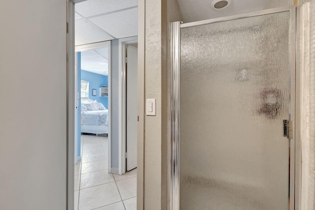 bathroom with tile patterned floors and an enclosed shower