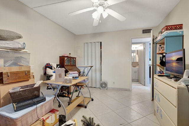 tiled office featuring ceiling fan