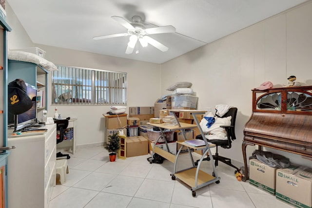 interior space with ceiling fan and light tile patterned flooring