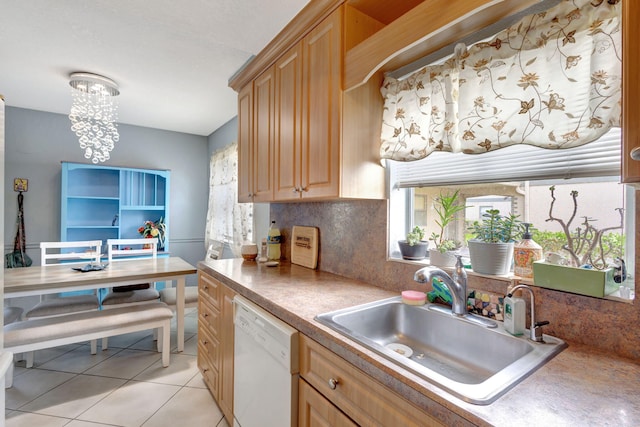 kitchen featuring a chandelier, dishwasher, sink, light tile patterned floors, and decorative backsplash