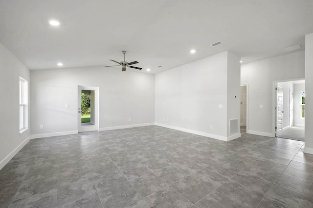 spare room featuring ceiling fan and lofted ceiling