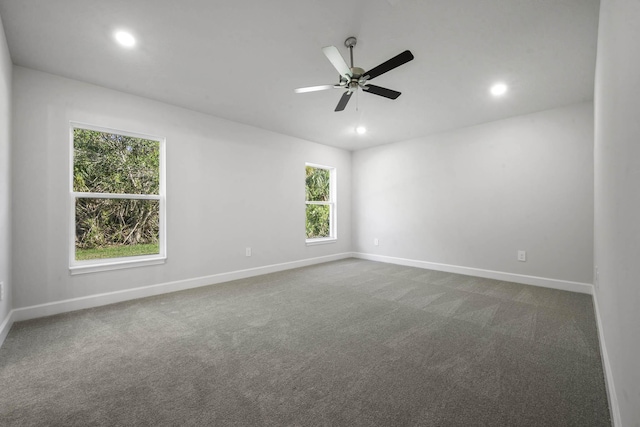 spare room with carpet and ceiling fan