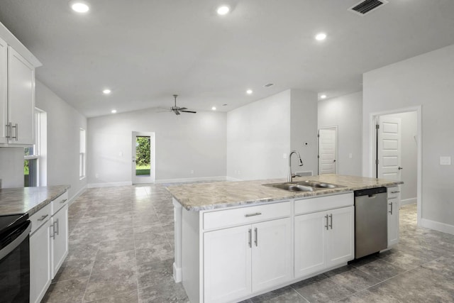 kitchen with white cabinetry, sink, stainless steel dishwasher, an island with sink, and vaulted ceiling