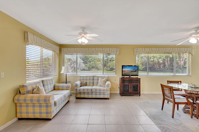 tiled living room with ceiling fan