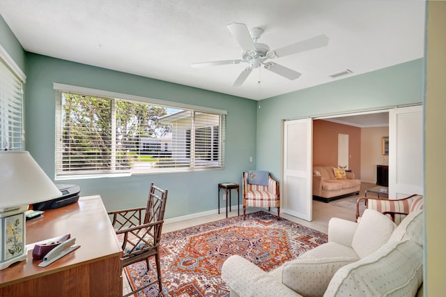 tiled home office with ceiling fan