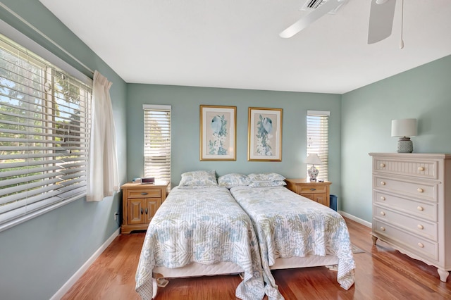 bedroom featuring light hardwood / wood-style flooring and ceiling fan