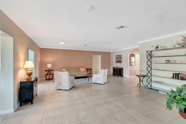 tiled living room with ornamental molding and a wealth of natural light