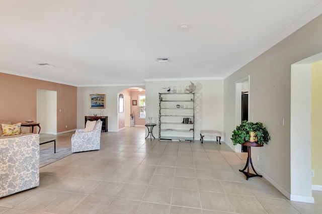 living room featuring ornamental molding and light tile patterned floors