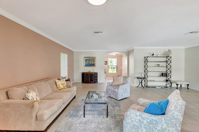 living room featuring light tile patterned flooring and ornamental molding