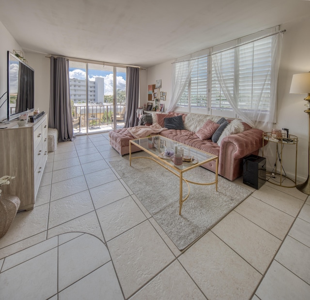 tiled living room featuring expansive windows