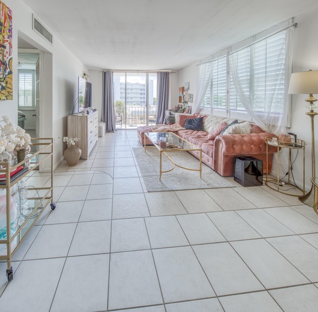 tiled living room with expansive windows