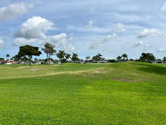 view of home's community featuring a yard