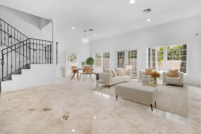 living room with french doors and ornamental molding