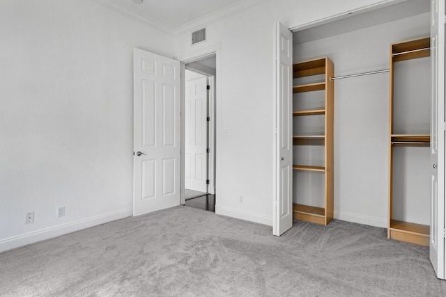 unfurnished bedroom with crown molding and carpet floors