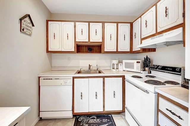 kitchen featuring sink, light tile patterned flooring, white cabinets, and white appliances