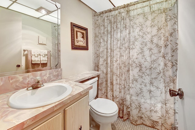 bathroom featuring vanity, a shower with curtain, and toilet