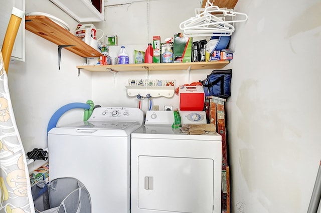 laundry area with washing machine and clothes dryer