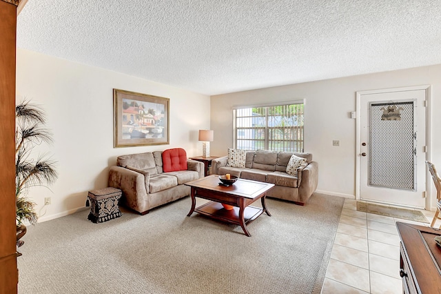 tiled living room featuring a textured ceiling